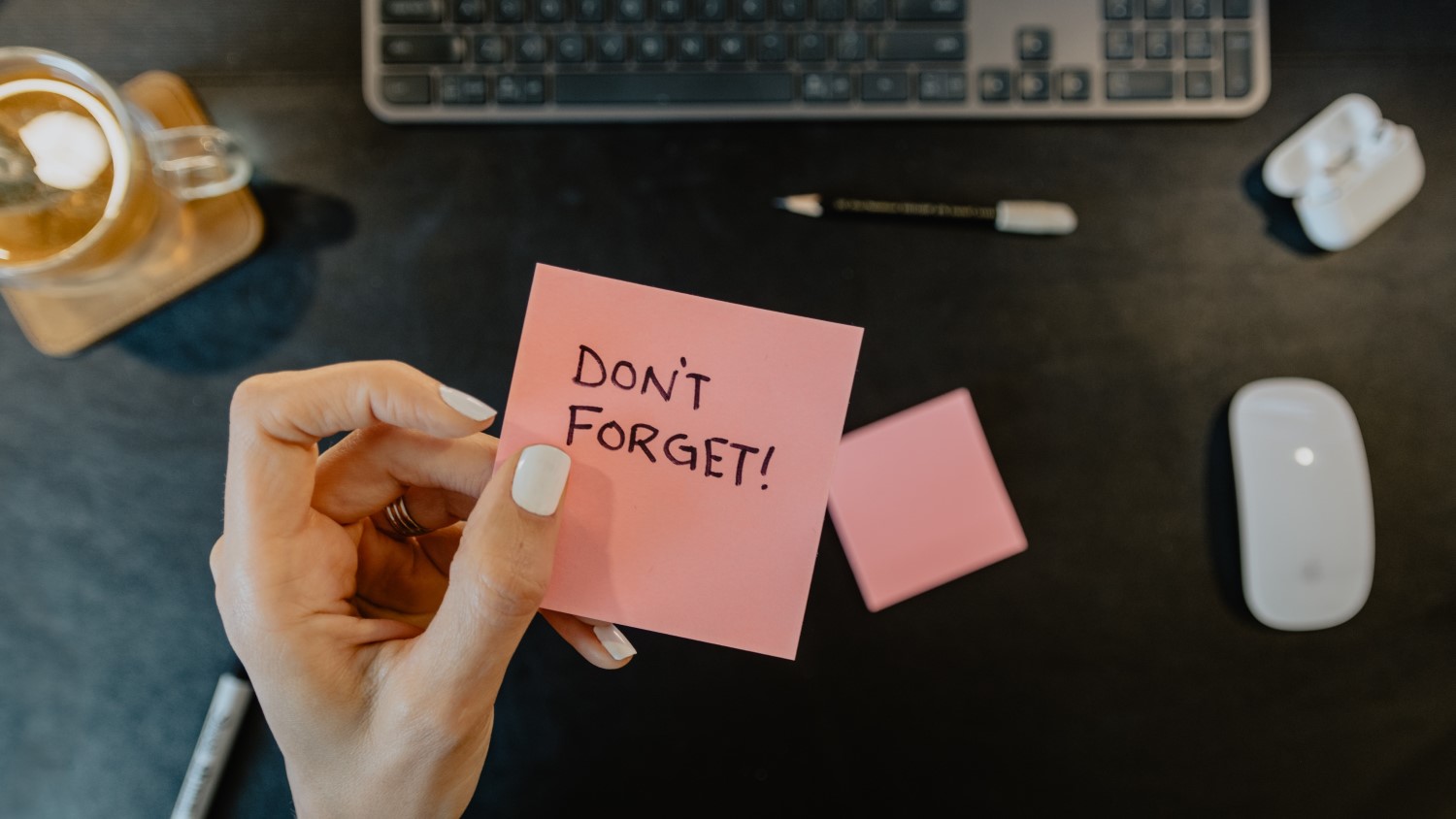 post-it note with a 'don't forget' reminder